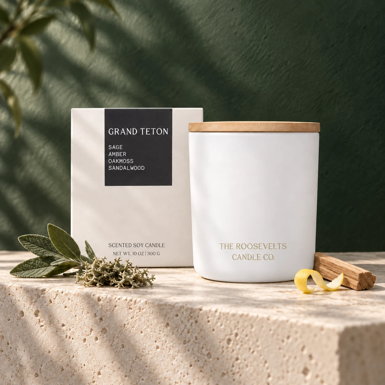 Grand Teton Candle candle and box in a forest-green and limestone still life