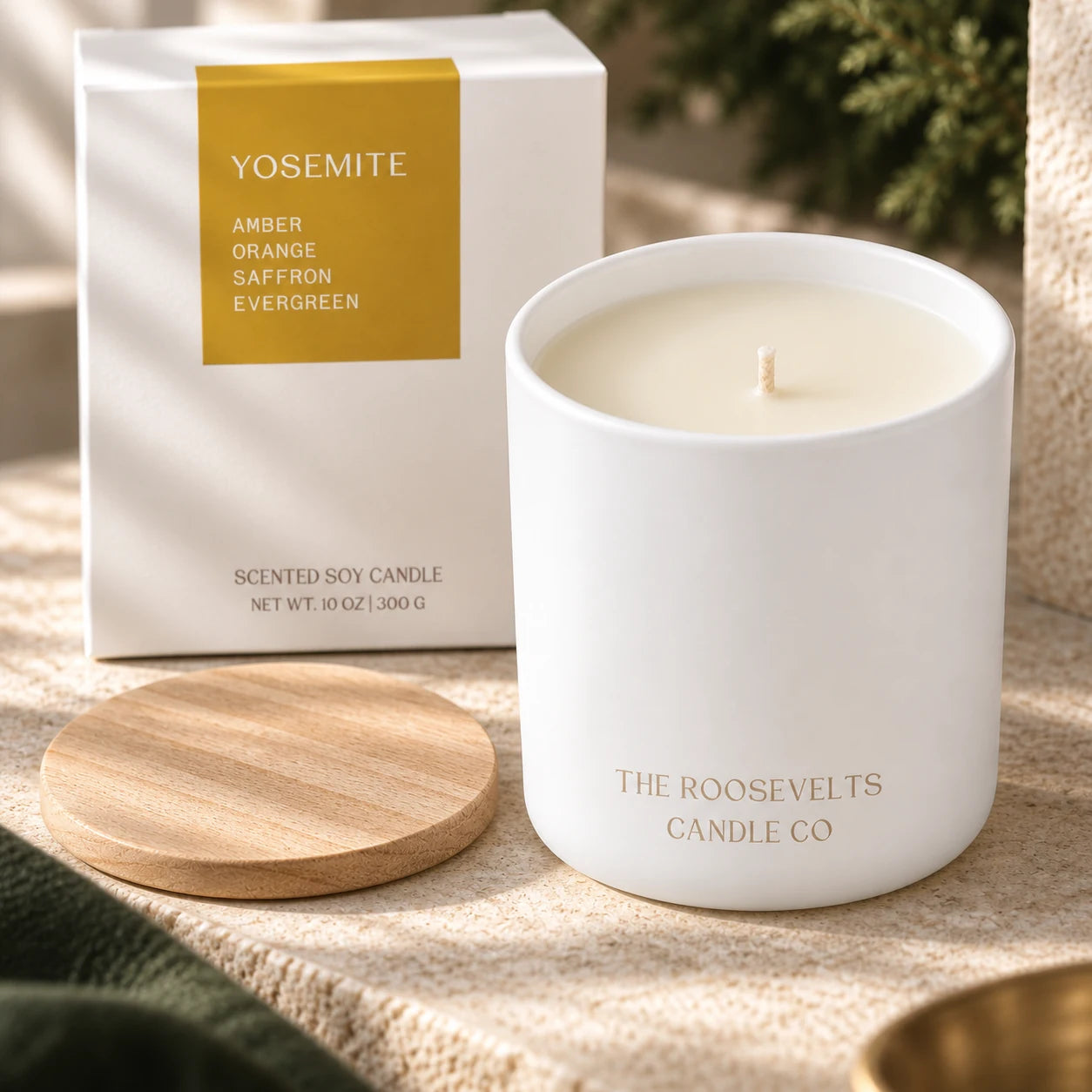 Yosemite Candle candle, wax, cotton wick and wooden lid in a styled detail photograph