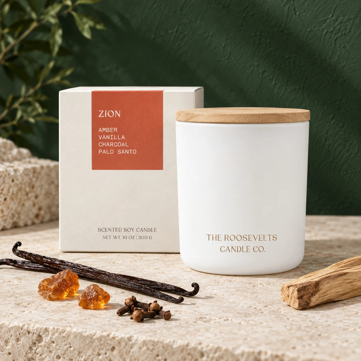 Zion Candle candle and box in a forest-green and limestone still life